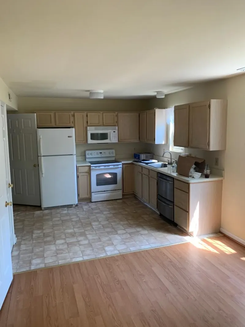 Worn hardwood floor before restoration